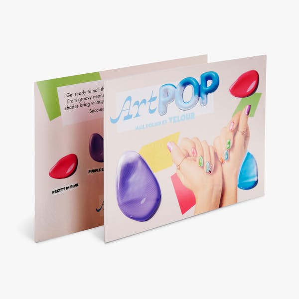 Two spot UV cards overlapping each other and printed with ArtPOP and hands with bright nail polish.