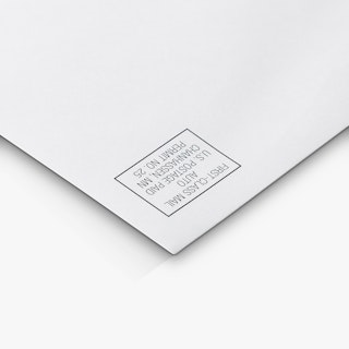 The top right corner of a business envelope custom printed with postage indicia.