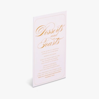 A wedding reception card printed with Desserts and Toasts in cursive orange font.