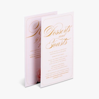 Two reception cards overlapping each other and printed with Desserts and Toasts in orange text.