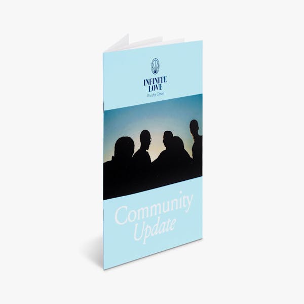 A religious booklet printed with a light blue background, Infinite Love and Community Update.