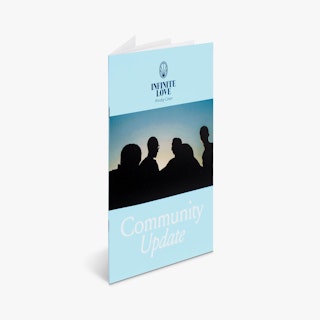 A religious booklet printed with a light blue background, Infinite Love and Community Update.
