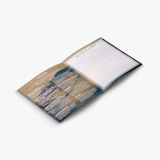 A church bi-brochure laying open to welcome messaging and a space for notes.