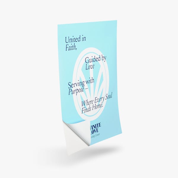 A religious wall decal printed in blue and white with one corner peeling off its backing.
