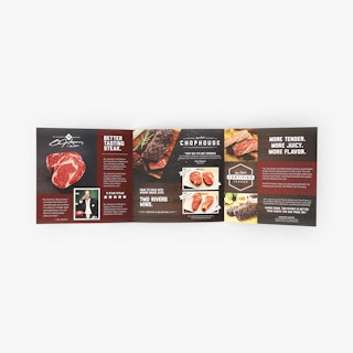 Restaurant brochure unfolded with three panels showing steak imagery and information.
