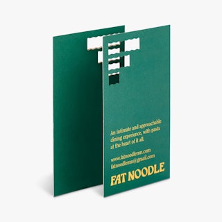 Two restaurant business cards overlapping each other and printed with Fat Noodle in yellow.
