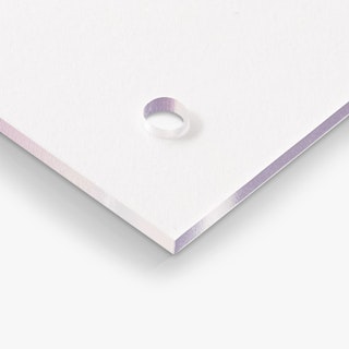 The corner of a clear acrylic sign with a hole for an aluminum standoff.