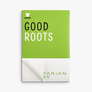 A green, white and black restaurant wall decal with one corner peeling away from the backing.