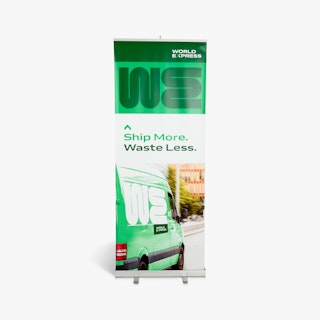 A custom pop up banner printed in white and green with a World Express van and silver stand.