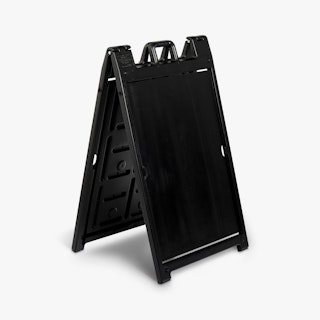 A black sandwich board sidewalk sign.