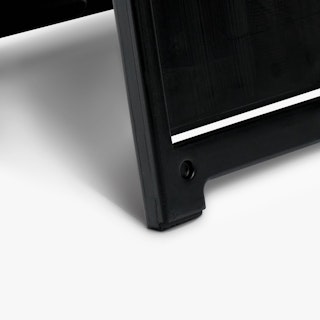 The bottom corner of a black sidewalk sign.