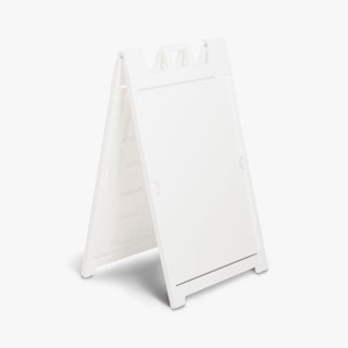 A white sandwich board sidewalk sign.