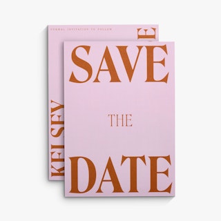 Two save the date cards overlapping each other with pink backgrounds and dark orange text.