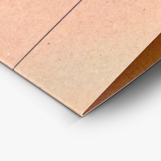 The bottom corner of a custom brochure printed on Kraft paper with a thin black line running across it.