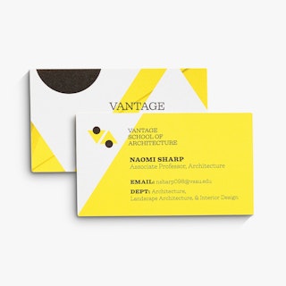 Two school business cards printed with a yellow, white and black design and school contact info.