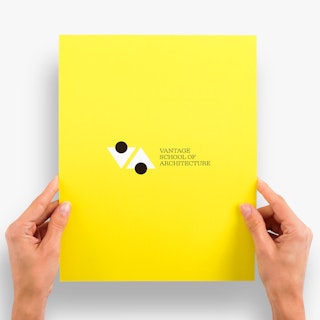 Two hands holding a yellow school certificate printed with Vantage School of Architecture in black.