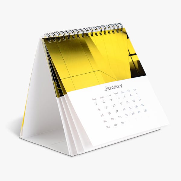 A desk calendar printed with a yellow, black and white design and January.