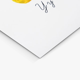 The bottom corner of a custom poster printed with a white background and the letter Y in black.