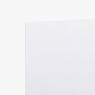 The bottom corner of a large poster printed with a solid white background.
