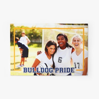 A rectangular wall decal for a classroom with three soccer players and a soccer net in the background.