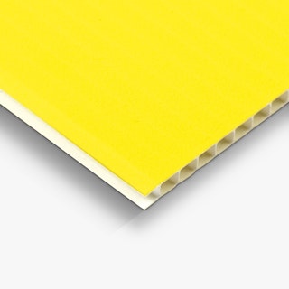 The bottom corner of a yard sign custom printed with a solid yellow background and and white edge.
