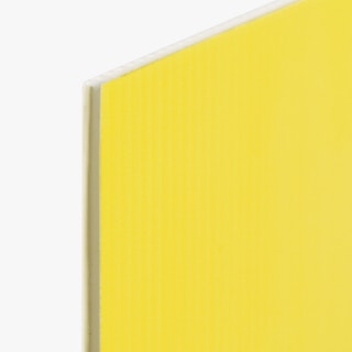 The top corner of a custom lawn sign printed with a bright yellow background and white edge.