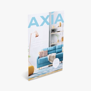 A custom sell sheet standing at an angle and printed with Axia in blue and an image of a living room.
