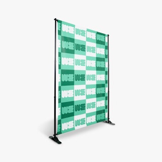 A step and repeat banner printed with a white and green design on a black banner stand.
