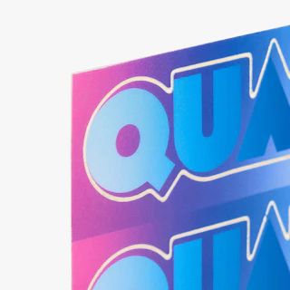 The top left corner of a custom sticker sheet printed with a pink, blue and white design.