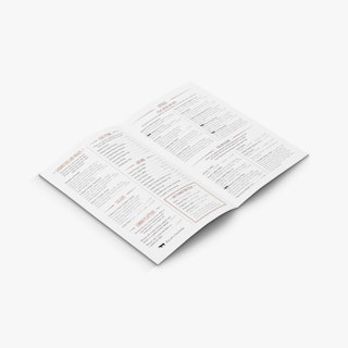A restaurant take-out menu laying open to food items listed on both panels.