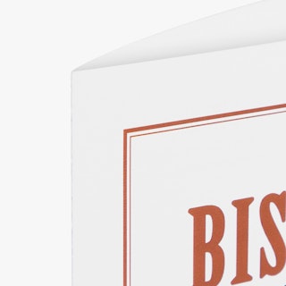 The top left corner of a take-out menu printed with a burnt orange and white design.