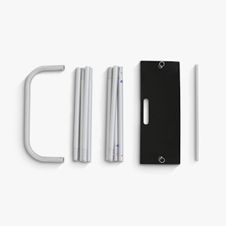 The parts of a tension fabric display frame laid out in a row.