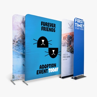 Four tension fabric displays in varying sizes with custom printed graphics for different businesses.