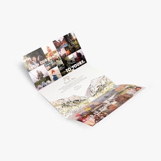 A tri-fold brochure with a tucked cover unfolded and laid out with images of families in the outdoors.