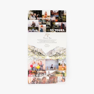 A tri-fold brochure with a tucked cover laying flat with images of smiling people and a mountain graphic.