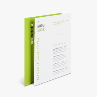 Two waterproof menus standing and overlapping each other with Good Roots printed in black and green.