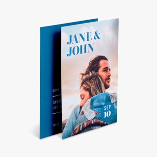 Two wedding invites overlapping each other and printed with Jane & John and a man and woman hugging.