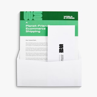 A custom letter mailer printed in green and white and a reply envelope coming out of a white envelope.