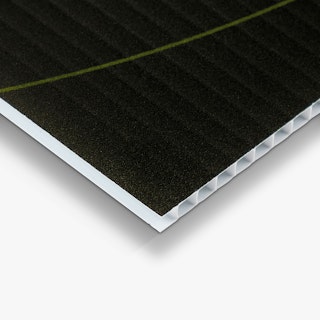 The bottom corner of a custom lawn sign printed with a black background.