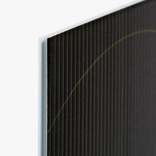 The top corner of a lawn sign custom printed with a black background and white edge.